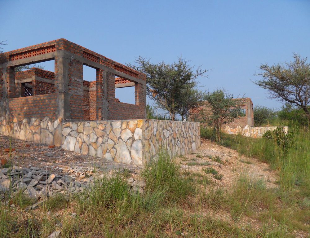 En Suite cottages under construction and awaiting thatched roofs July 2011