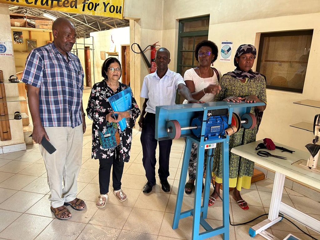 IWO projects team buying the leather stitching machine from Crane Shoes