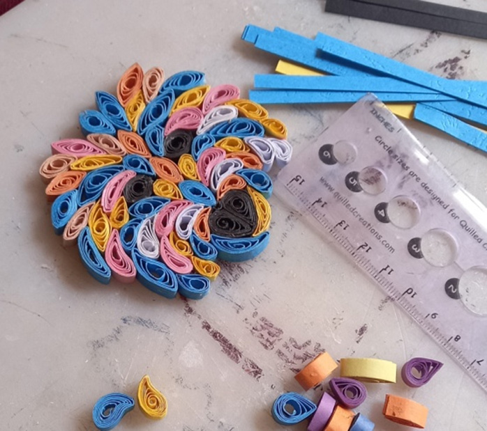The abstract dog face quilling ornament being produced by Beauty for Ashes, Jinja Photo, courtesy of Meg Jaquay